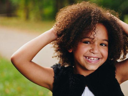 Curls to Sleek: A Guide to Safely Straightening Kids' Curly Hair